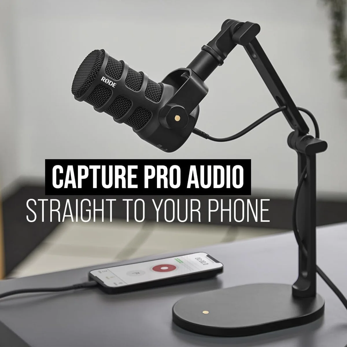 Rode PodMic USB on a boom arm — close-mic positioning for optimal broadcast tone